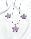 Set estrellas de mar moradas con plateado