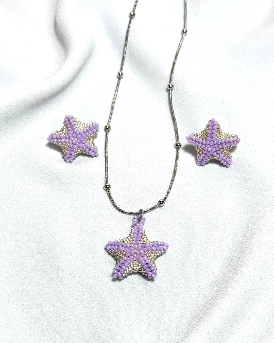 Set estrellas de mar moradas con plateado
