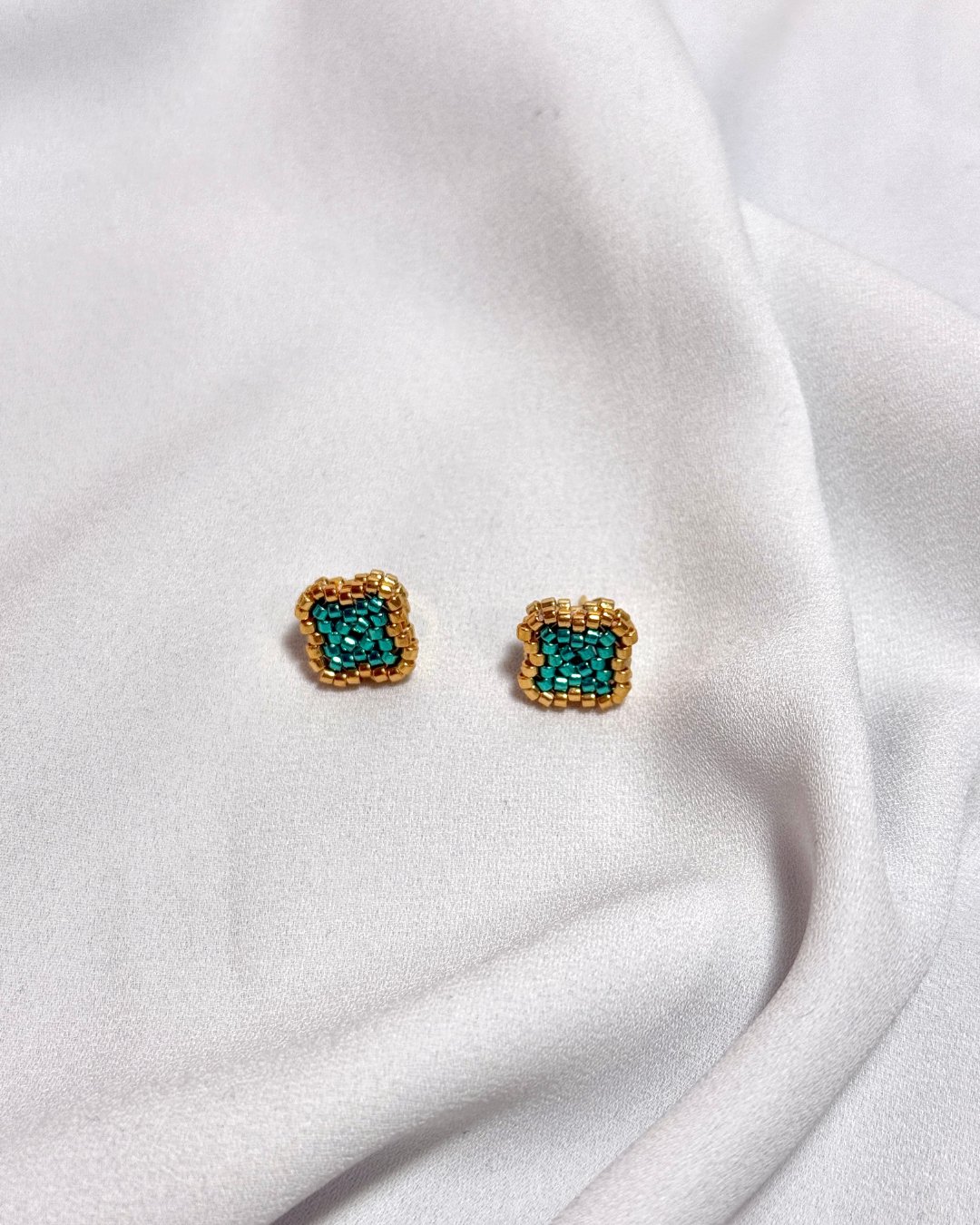 Topos en trébol reflejo dorado