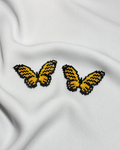 Aretas mariposa vuelo solar